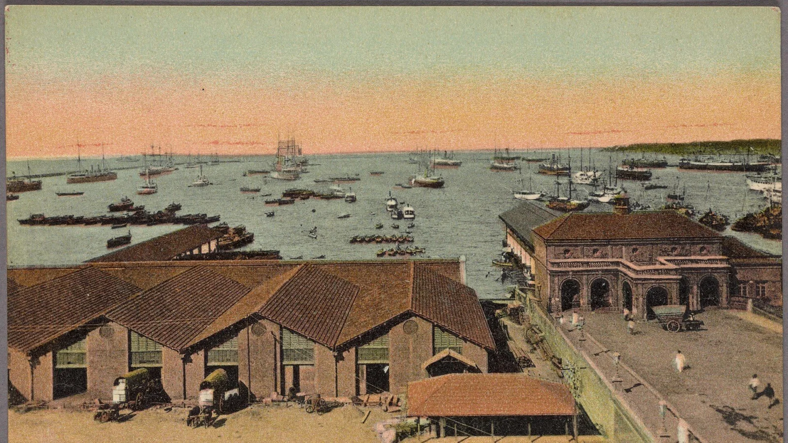 Colombo harbour with warehouses, sailing ships and steamers, from a hand-coloured postcard of 1907