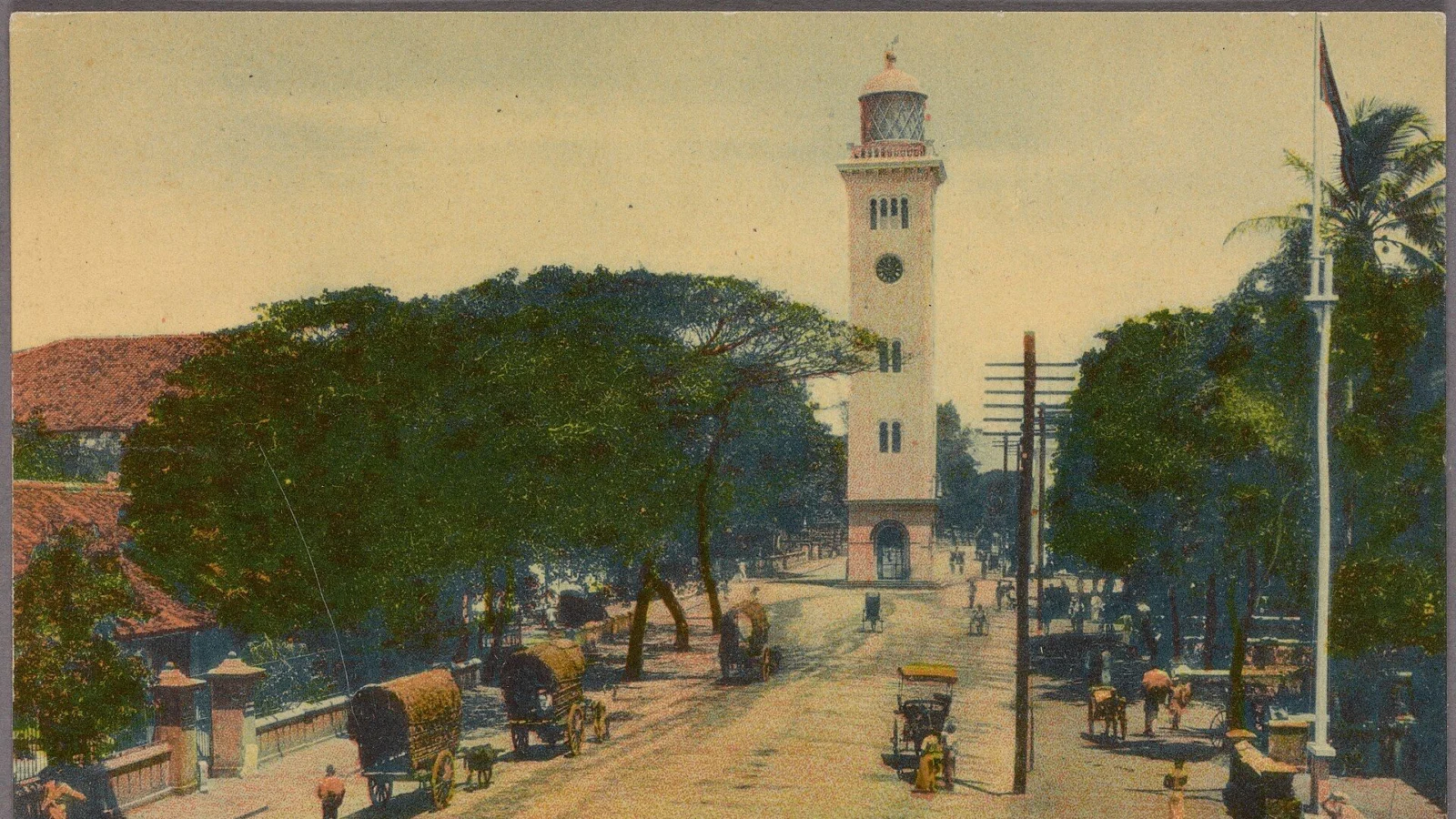 Queen Street in Colombo Fort with the old lighthouse clock tower, from a hand-coloured postcard of 1907